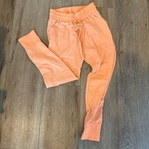 free people movement orange joggers